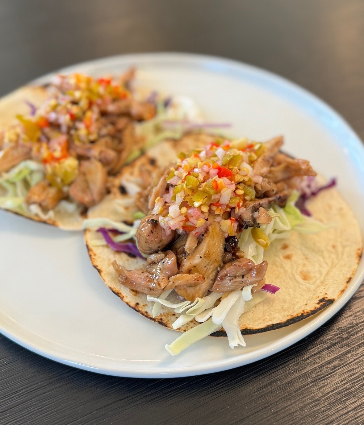 6oz Chicken Thigh tossed in a house-made Bourbon Sauce in 2 Flour Tortillas topped with a Spicy Pepper Relish and Shredded Slaw.