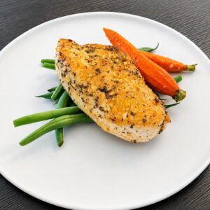 “Herbed Honey Mustard Chicken” (Low Carb) - 6oz Chicken Breast Herb Crusted with a Honey Mustard Glaze served with Roasted Baby Carrots and Blanched Green Beans. This is a low carb dish.