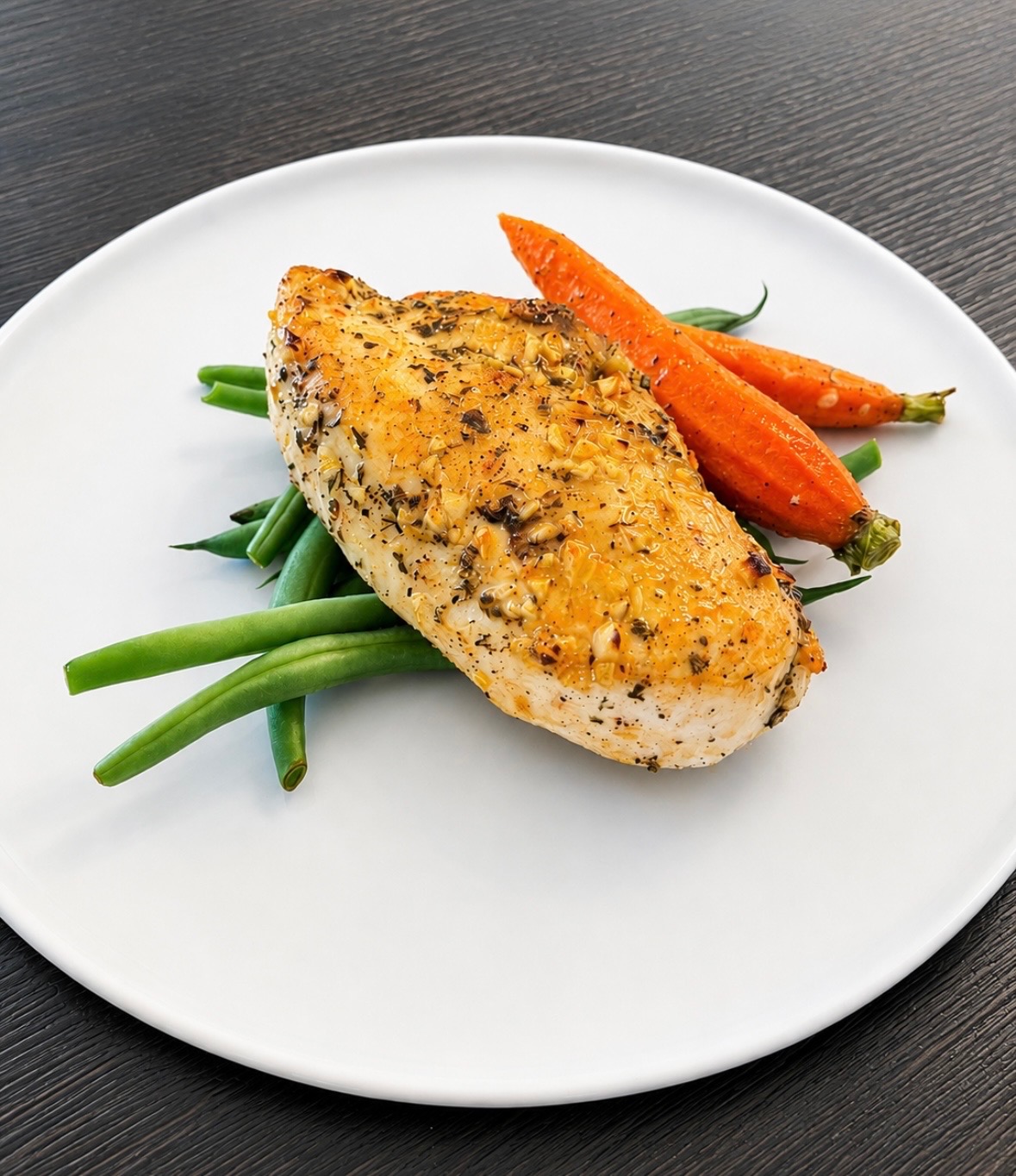 “Herbed Honey Mustard Chicken” (Low Carb) - 6oz Chicken Breast Herb Crusted with a Honey Mustard Glaze served with Roasted Baby Carrots and Blanched Green Beans. This is a low carb dish.